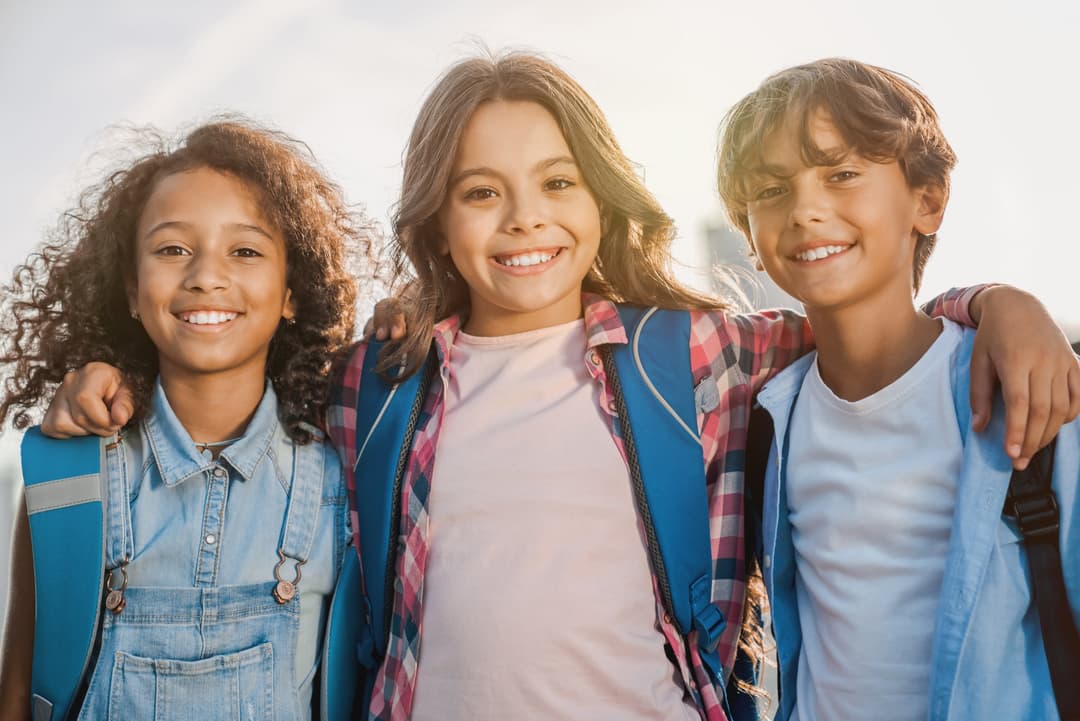 Patient smiling confidently while wearing dental braces